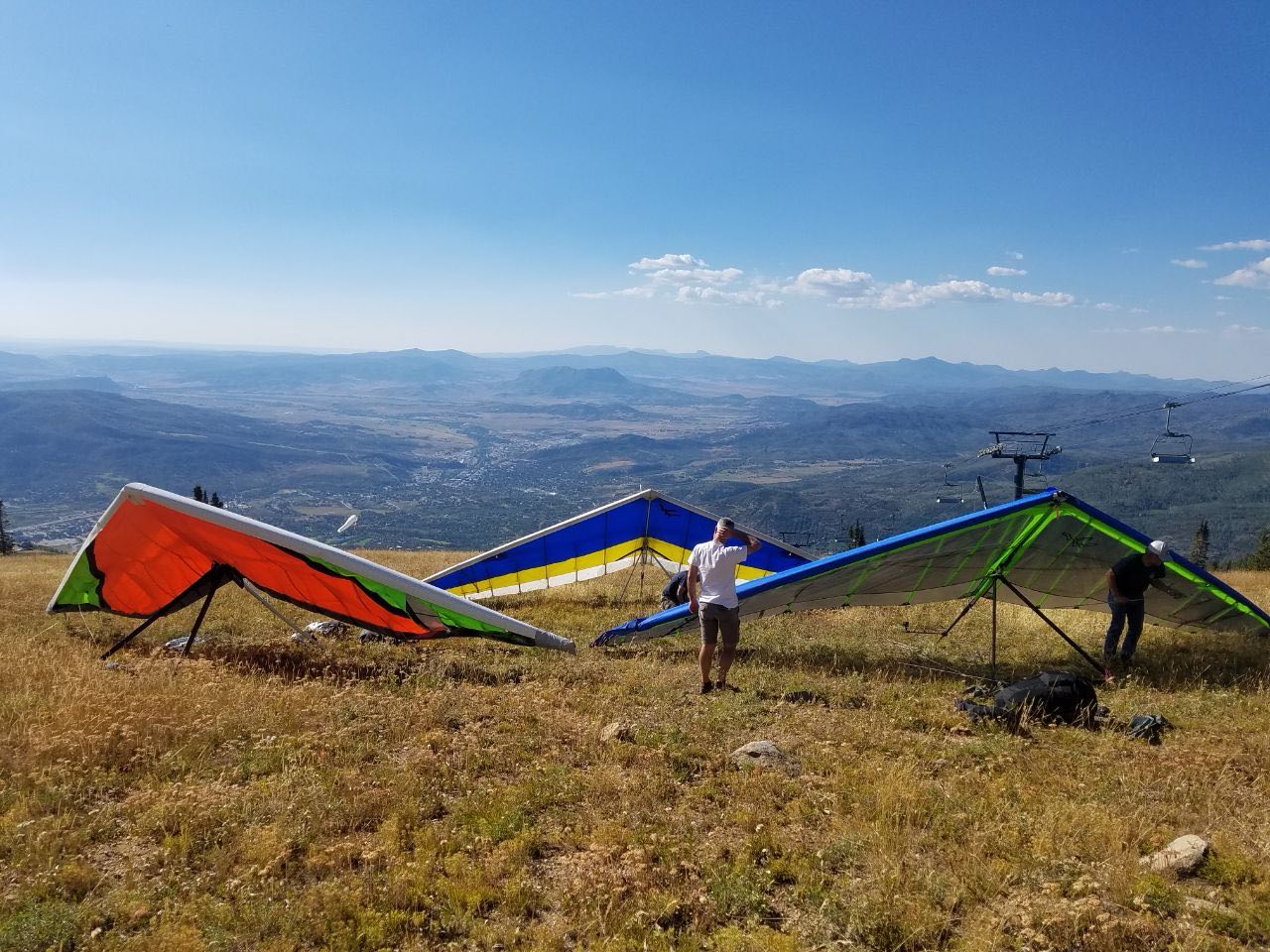 three hang gliders